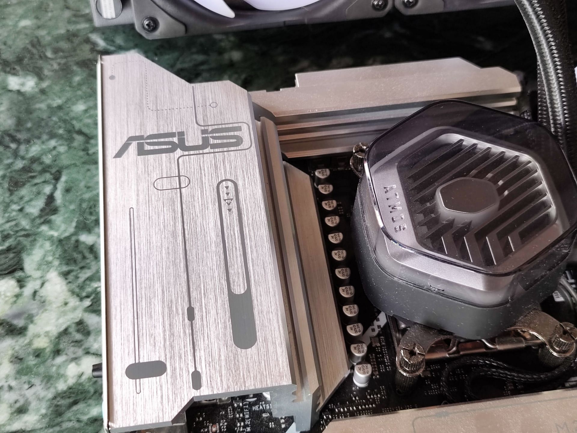 The Prime X870-P doesn't skimp on its VRM heatsinks (Image via Sportskeeda)